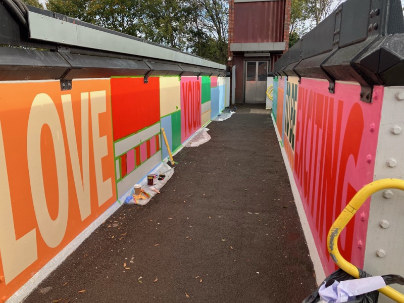 New artwork brings a splash of colour to Merseyside station bridge